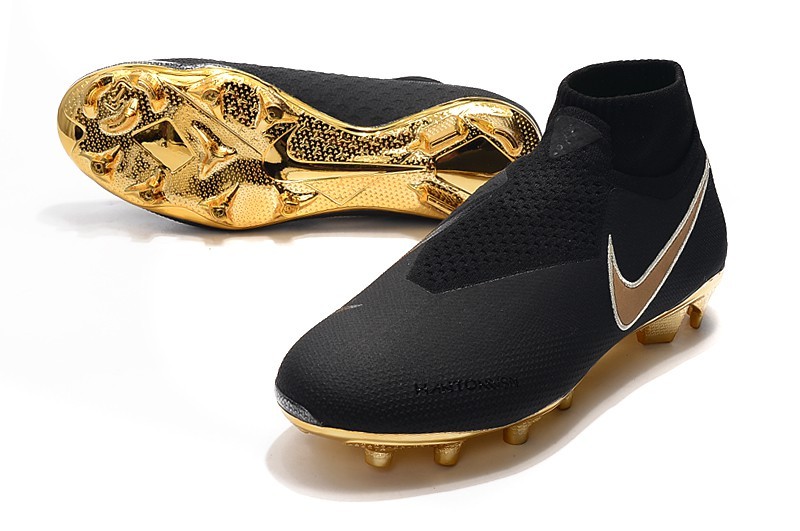 gold and black football boots